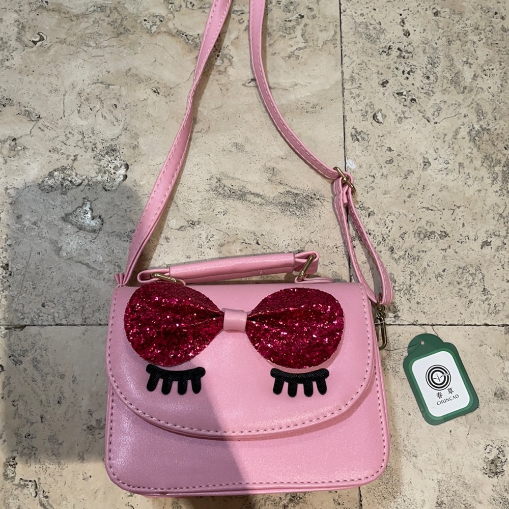 Pink eye shoulder bag